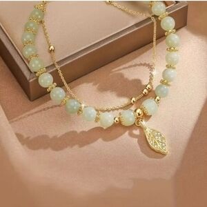 BOHO Glass Bead Bracelet In Jade With Gold Tone Attached Chain Leaf Pendant New